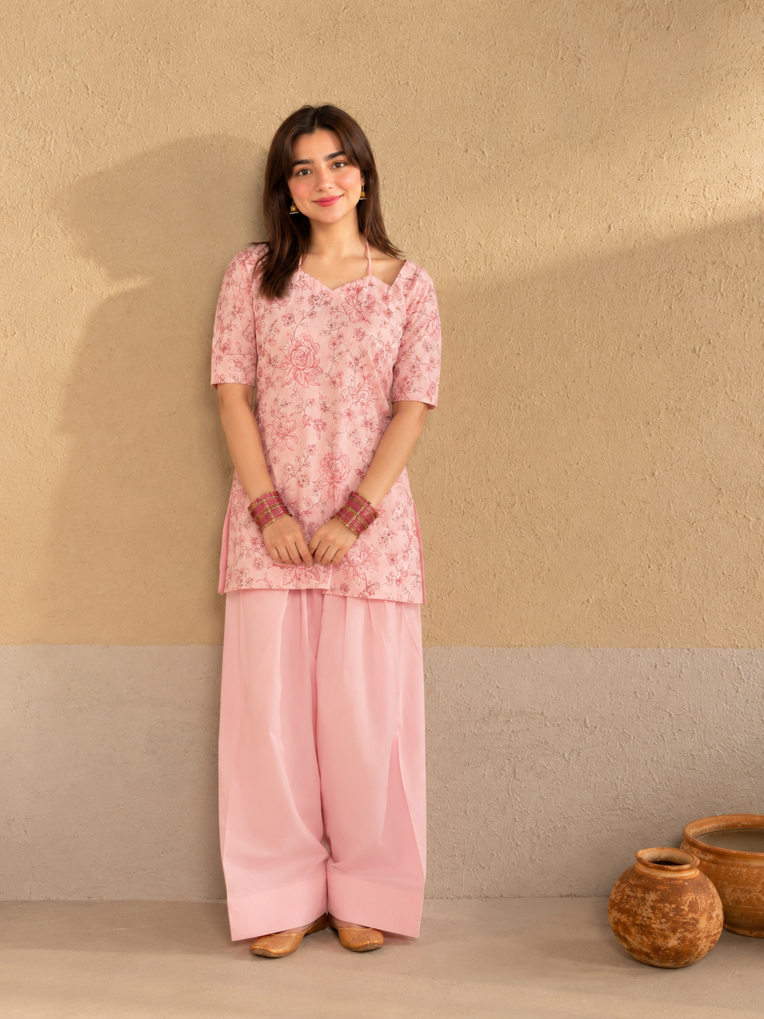 Bahaar Bloom pink floral crepe shirt with plain wide-leg trousers, front view.