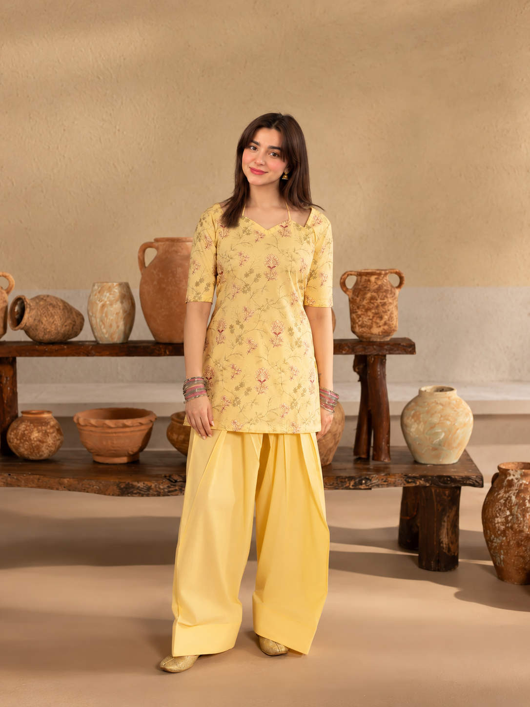 Basant Bloom butter-yellow printed crepe shirt and plain palazzo trousers, front view.
