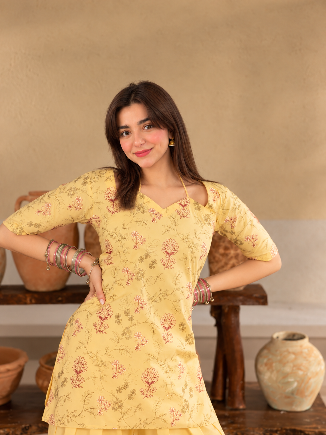 Basant Bloom butter-yellow printed crepe shirt and plain palazzo trousers, neckline detail view.
