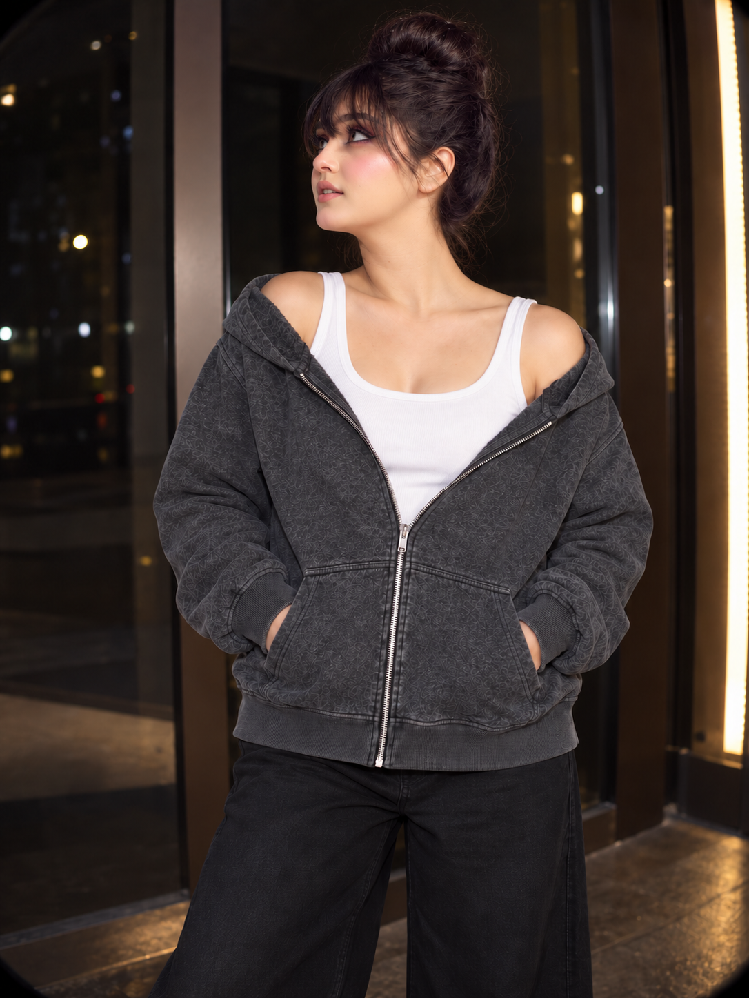 Dusk Zip Hoodie in charcoal grey, both shoulders dropped hands in pockets