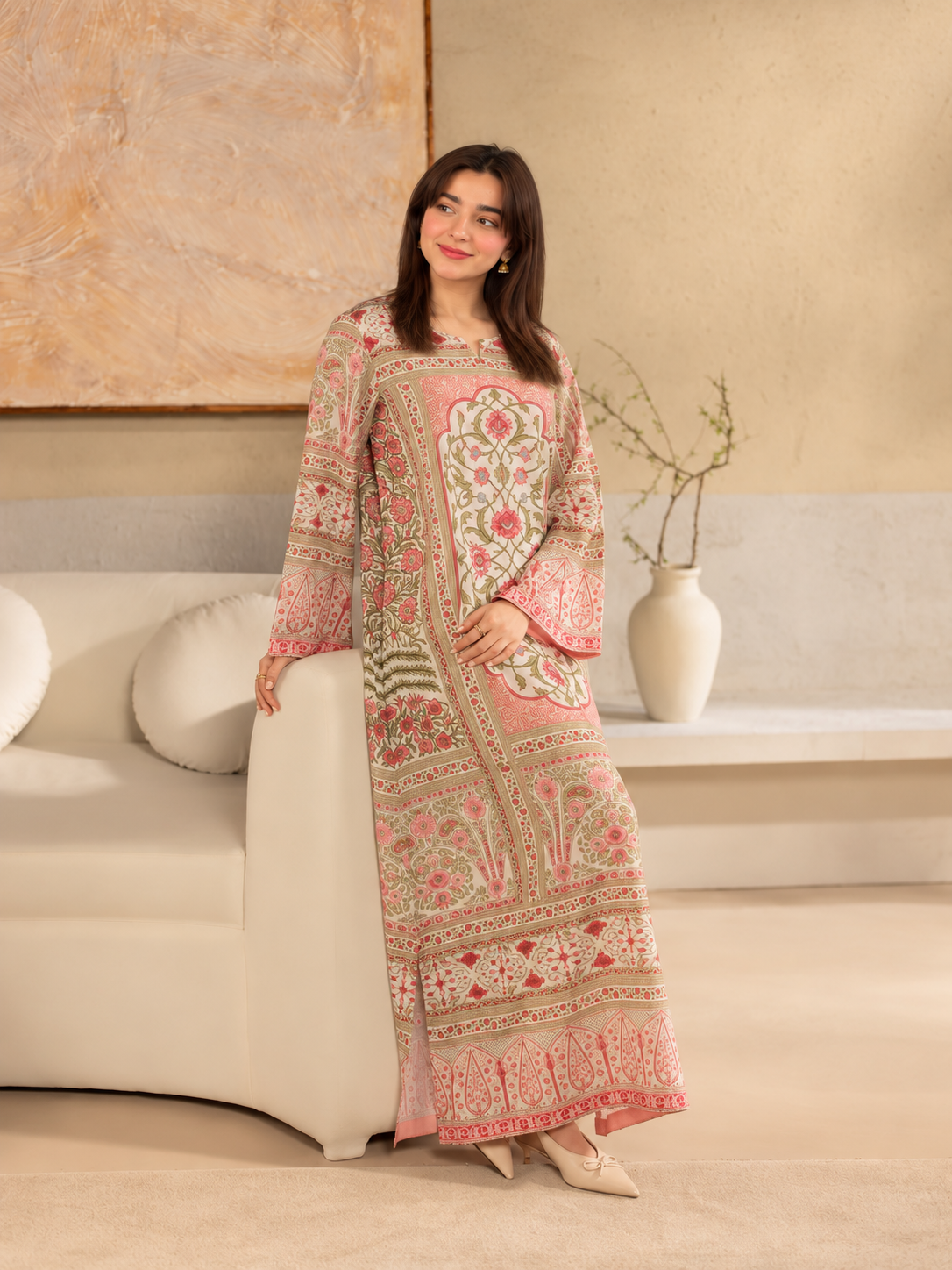Gulistan Kaftan ivory, pink and olive printed crepe two-piece outfit, sofa standing view.