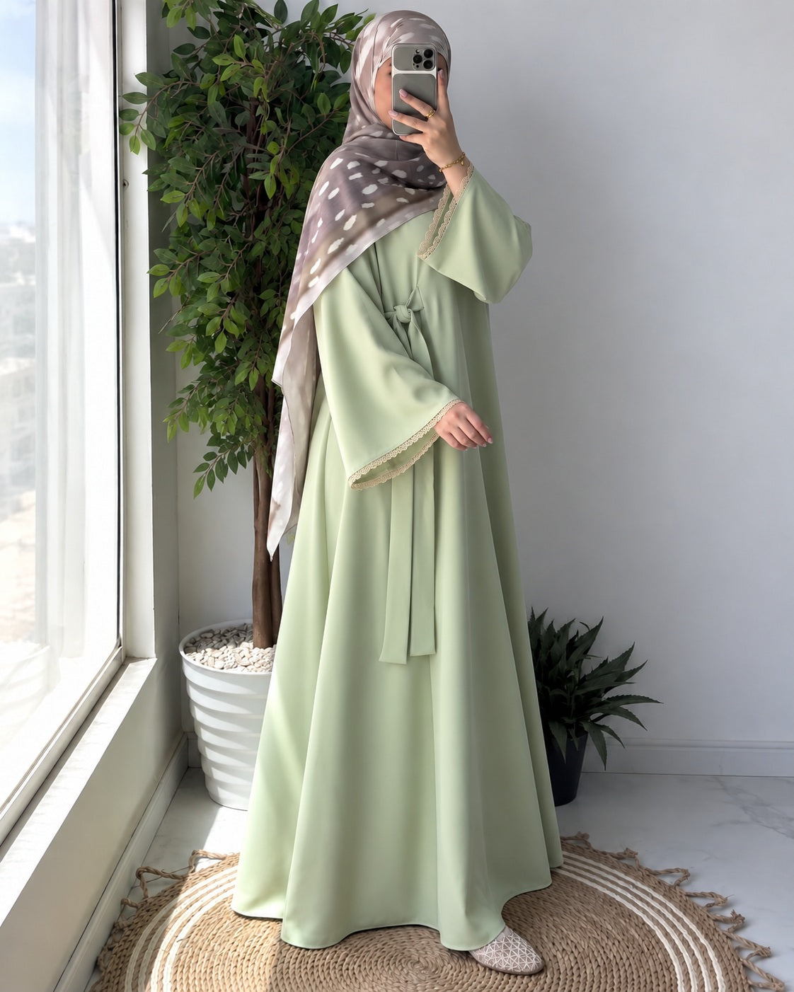 Inaya Bloom Abaya, full-length side pose in sage green.