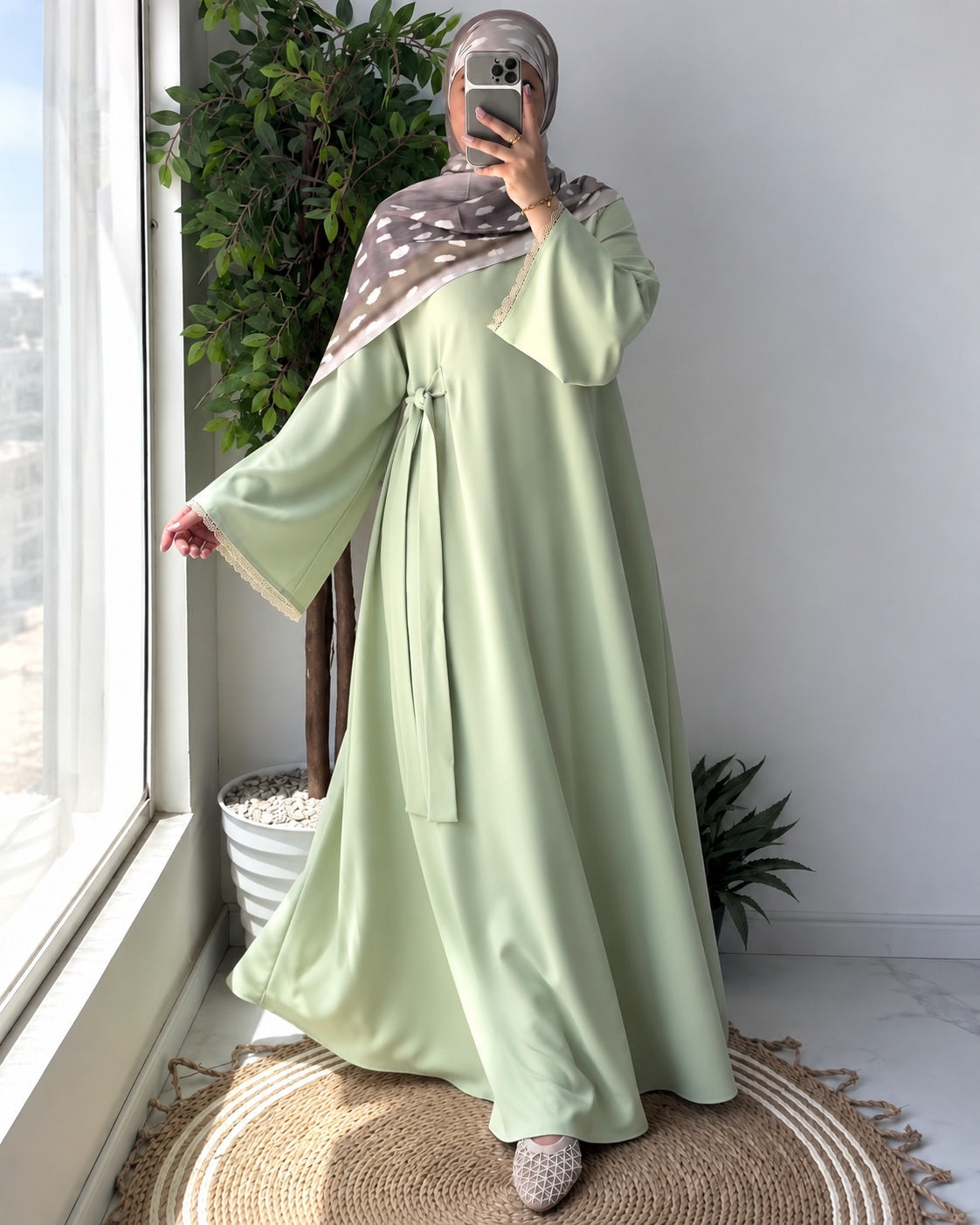 Inaya Bloom Abaya, movement pose showing flowing silhouette.