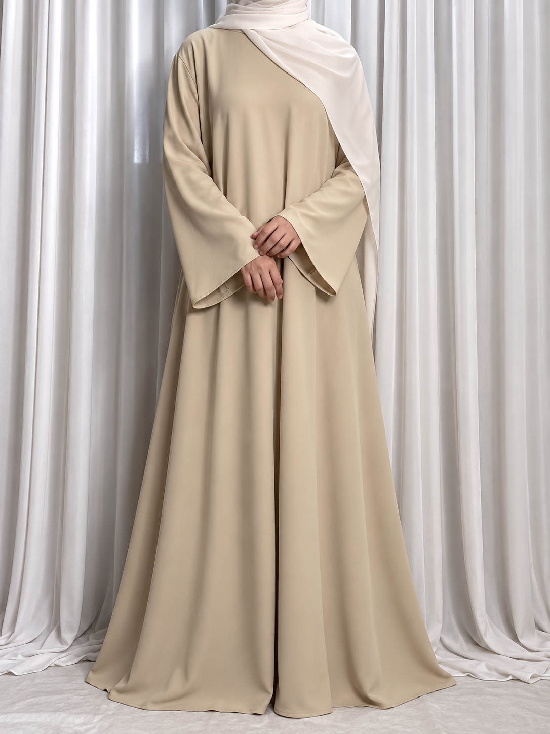 Nazakat Abaya in Beige Nida fabric, front view. Abaya only; hijab not included.