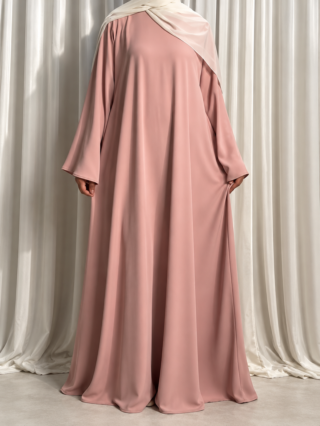 Nazakat Abaya in Dusty Pink Nida fabric, front view. Abaya only; hijab not included.