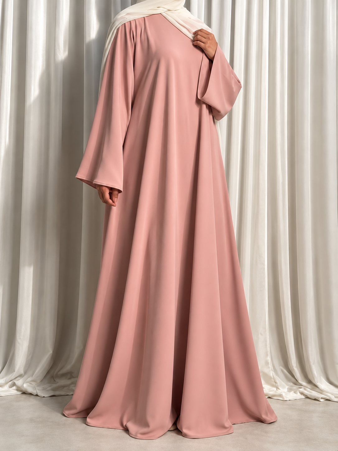 Nazakat Abaya in Dusty Pink Nida fabric, three quarter view. Abaya only; hijab not included.