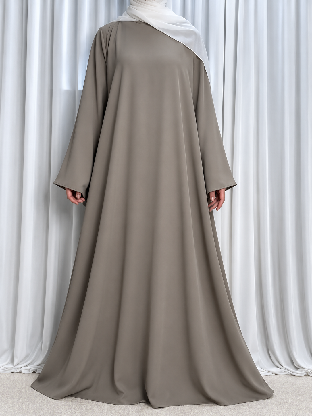 Nazakat Abaya in Warm Grey Nida fabric, front view. Abaya only; hijab not included.