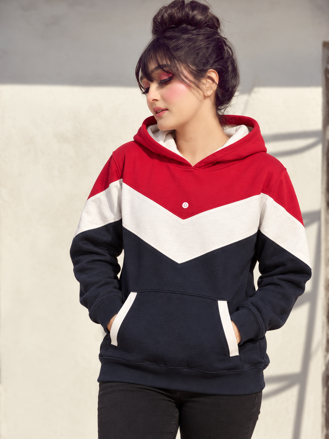 Retro Chevron Hoodie in red, off-white and navy, both hands in kangaroo pocket