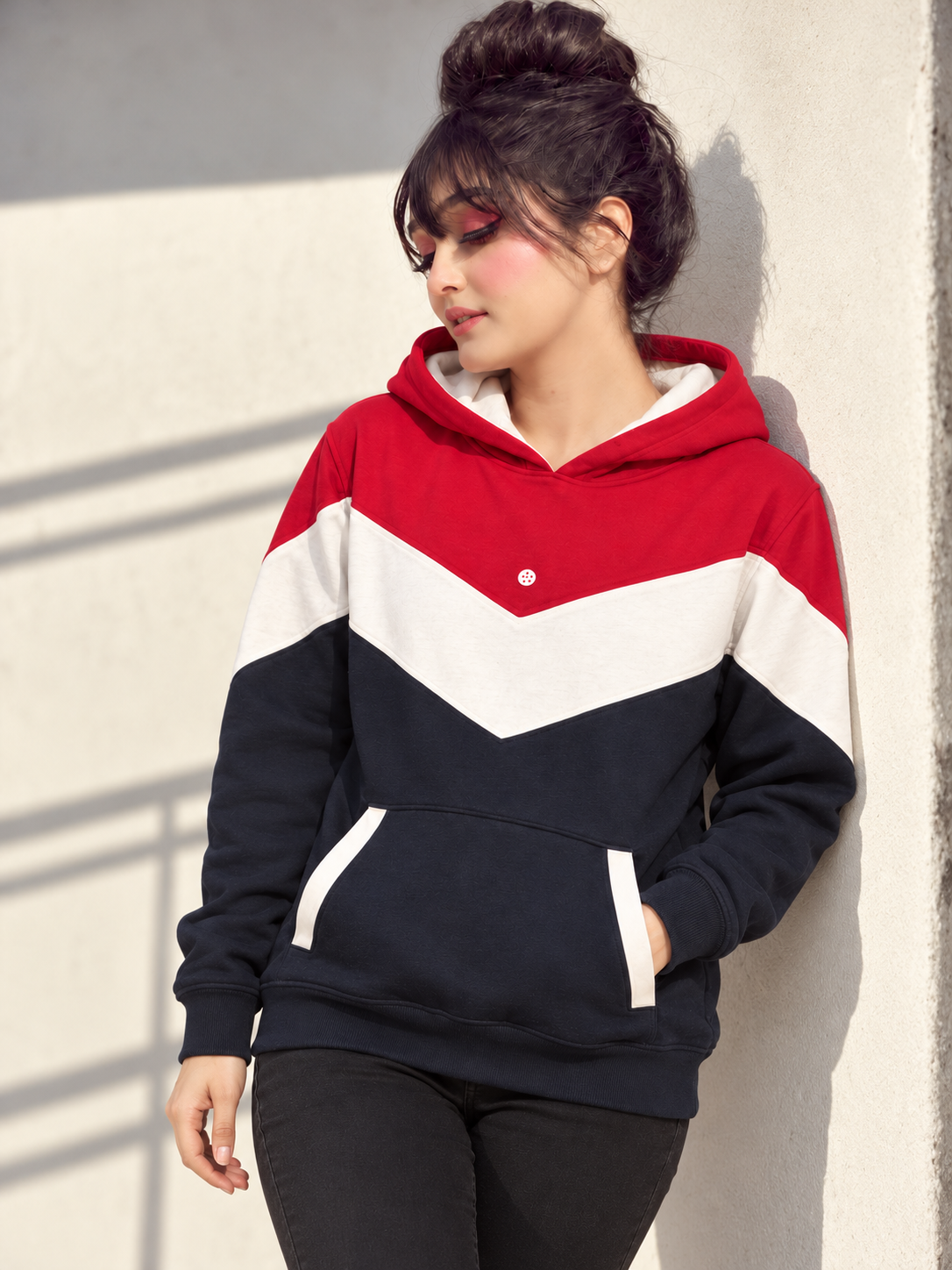 Retro Chevron Hoodie in red, off-white and navy, wall lean with one hand in pocket